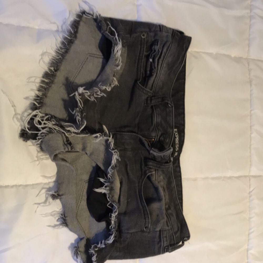 Grey fringe low rise shorts.
